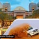 Ras Al Khaimah resort with dome architecture, pool area, and white SUV in desert landscape