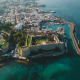 Aerial view of Kyrenia Castle and harbor in Cyprus with turquoise Mediterranean Sea and white-washed buildings