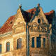 Historic Art Nouveau building with ornate stone facade and copper roof in Riga, Latvia, featuring decorative gables and a sea