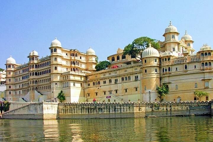 Arrival in Udaipur; Check-In & Visit City Palace, Jagdish Temple, Lake Pichola (Evening Boat Ride), & Local Market Walk