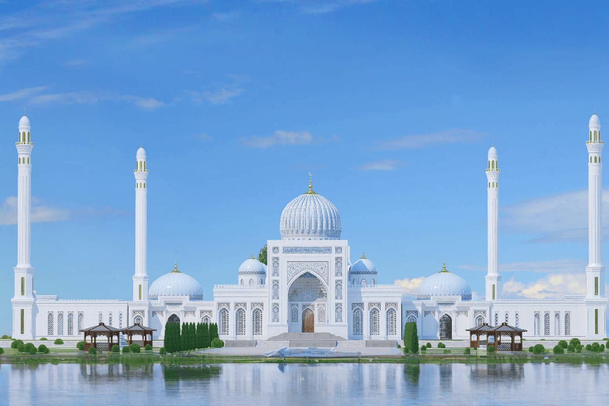 White Islamic mosque complex with dome and minarets reflected in water, featuring ornate architecture and landscaped gardens