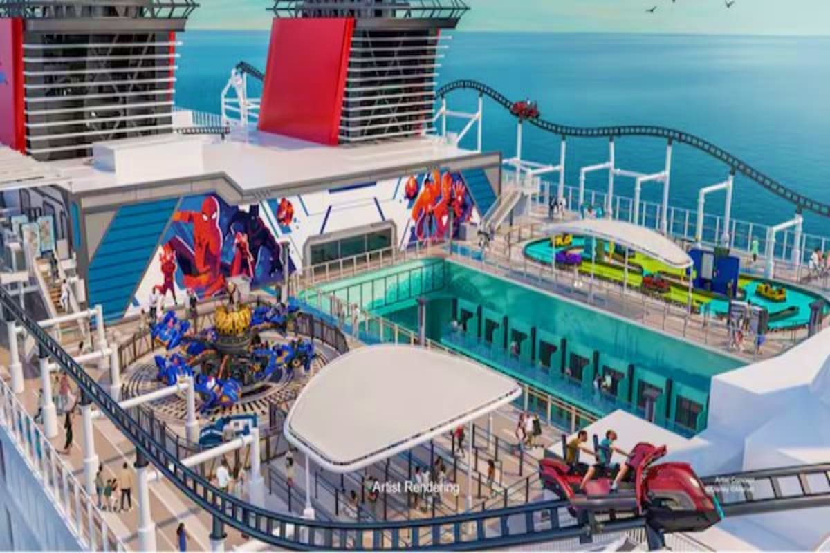Aerial view of Disney cruise ship deck showing themed areas including character displays, swimming pools, water slides, and o