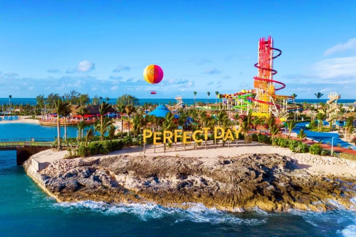 Perfect Day at CocoCay water park with colorful slide tower, beach, lagoon, and hot air balloon at Royal Caribbean private is