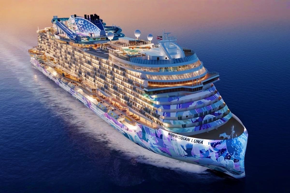 Norwegian Luna cruise ship sailing on blue ocean water with multiple decks and entertainment venues visible from aerial view