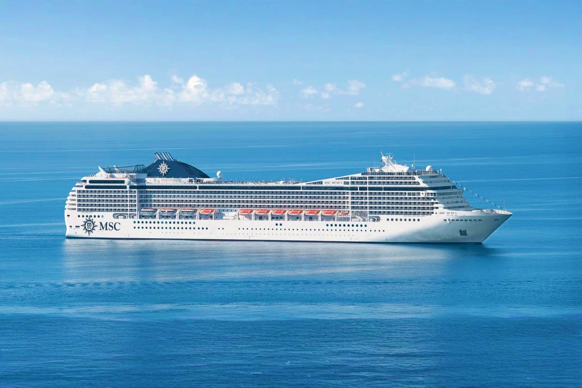 MSC Musica cruise ship sailing in clear blue Mediterranean waters under partly cloudy sky