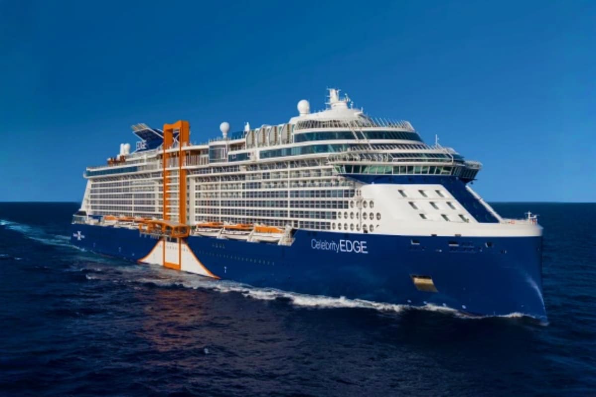 Celebrity Edge cruise ship sailing on open ocean with blue water and clear sky