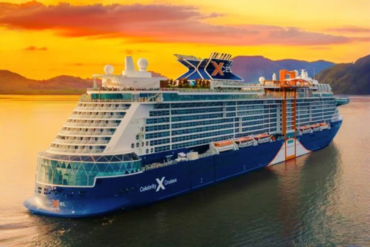 Celebrity Xcel Mediterranean Escape Celebrity Xcel cruise ship anchored in calm blue waters at sunset with golden sky and mountains in background