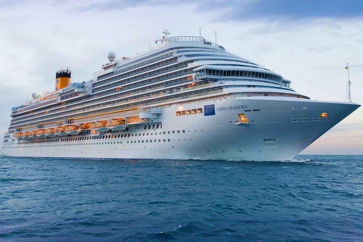 Costa Diadema cruise ship sailing on blue ocean waters with white and blue hull design