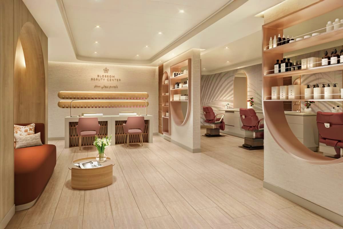 Modern luxury beauty center interior with wooden shelving, burgundy chairs, reception desk, and spa treatment areas