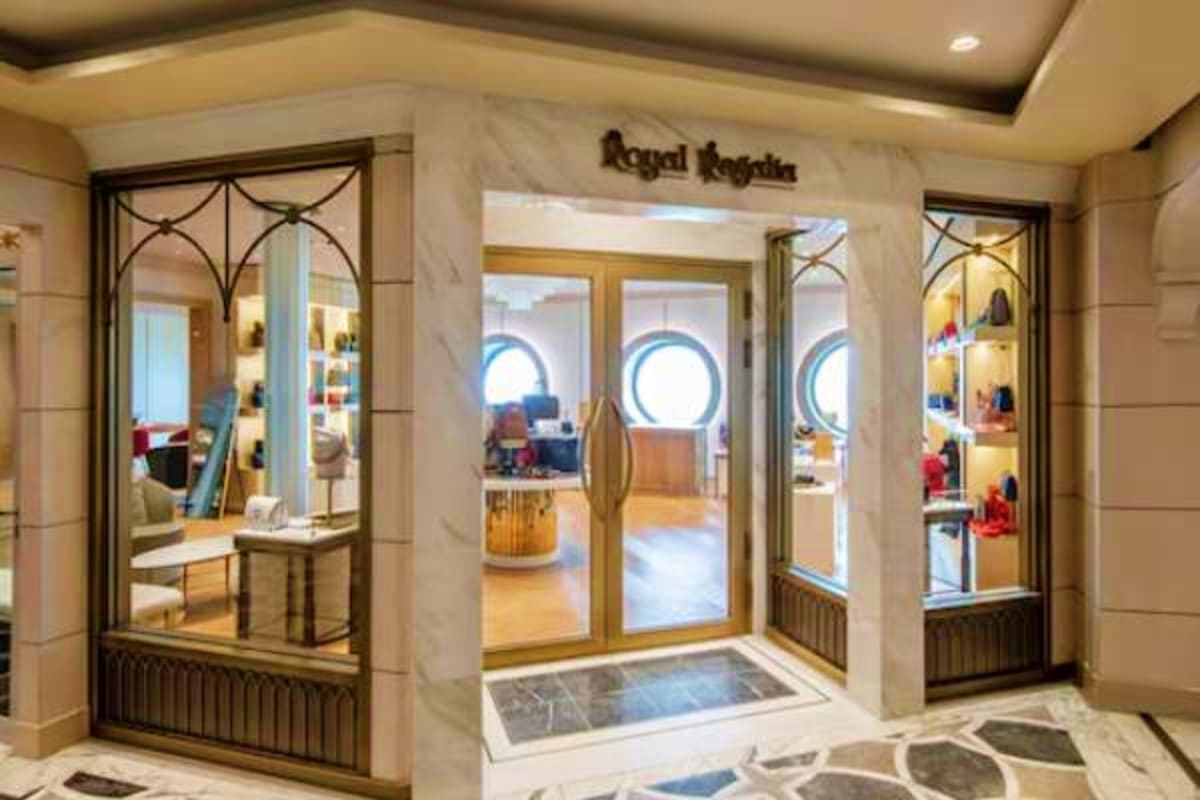 Royal Regalia boutique storefront on Disney Treasure cruise ship with elegant marble facade and glass display windows
