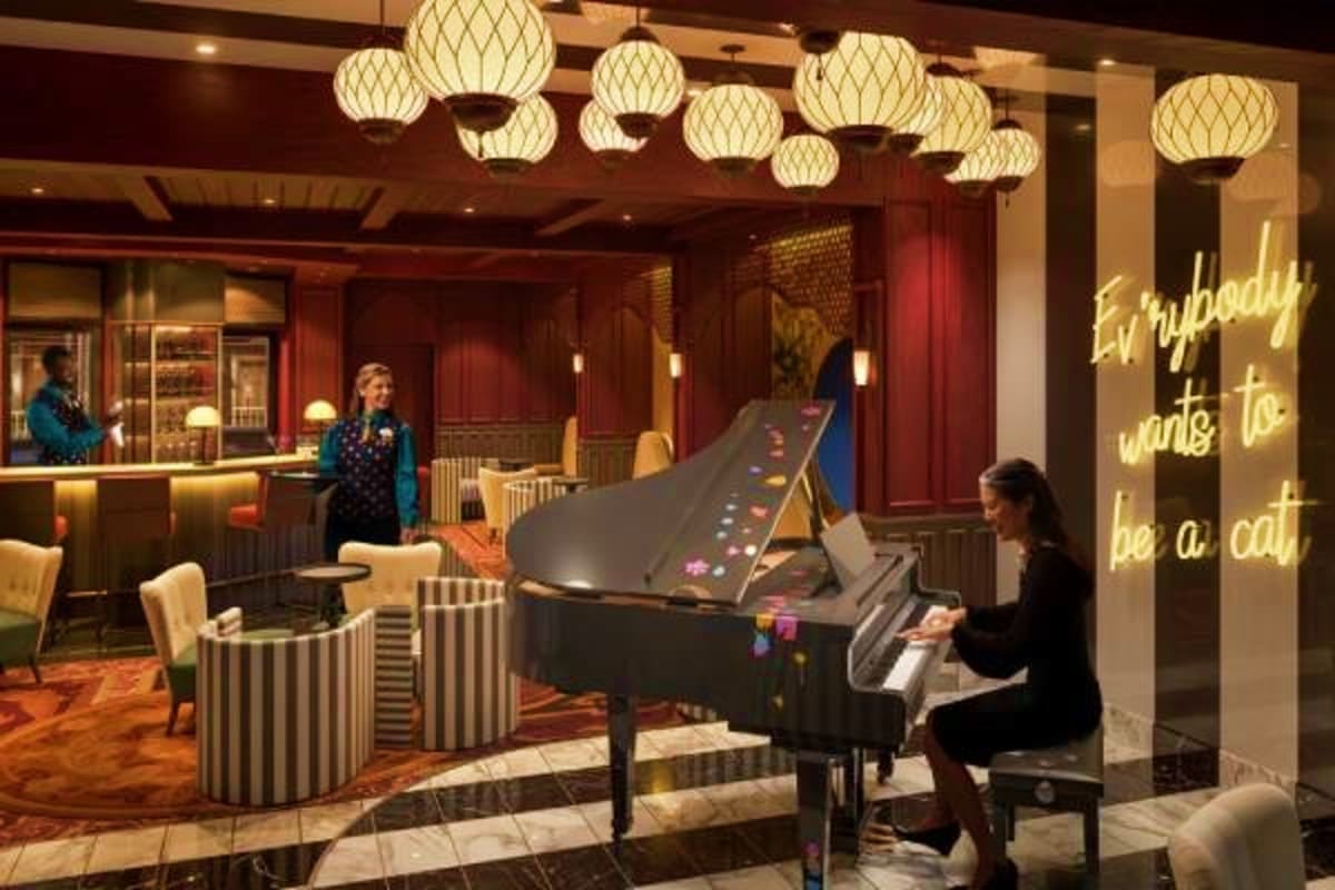 Elegant ship lobby with woman playing grand piano, Asian-inspired pendant lighting, red wood paneling, and neon sign reading 