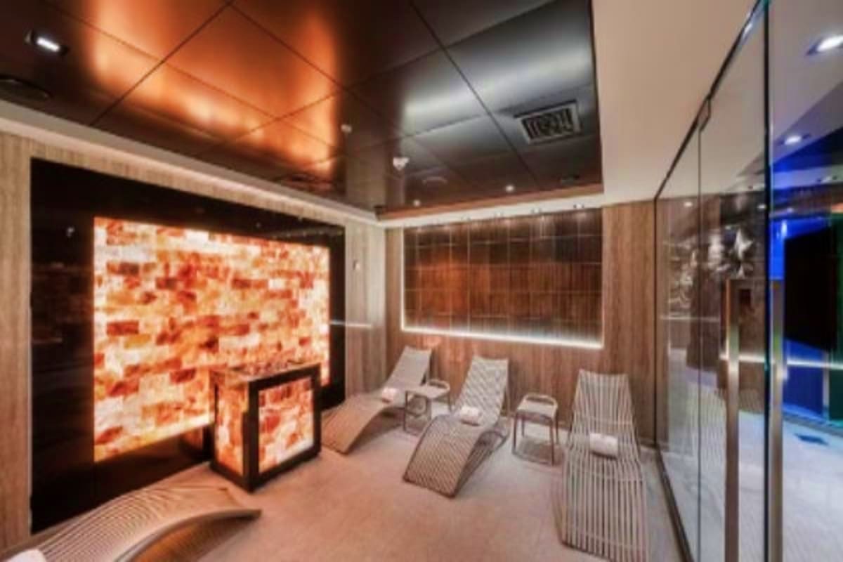 Modern spa relaxation area on MSC Euribia cruise ship with lounge chairs, illuminated wellness displays, and contemporary int
