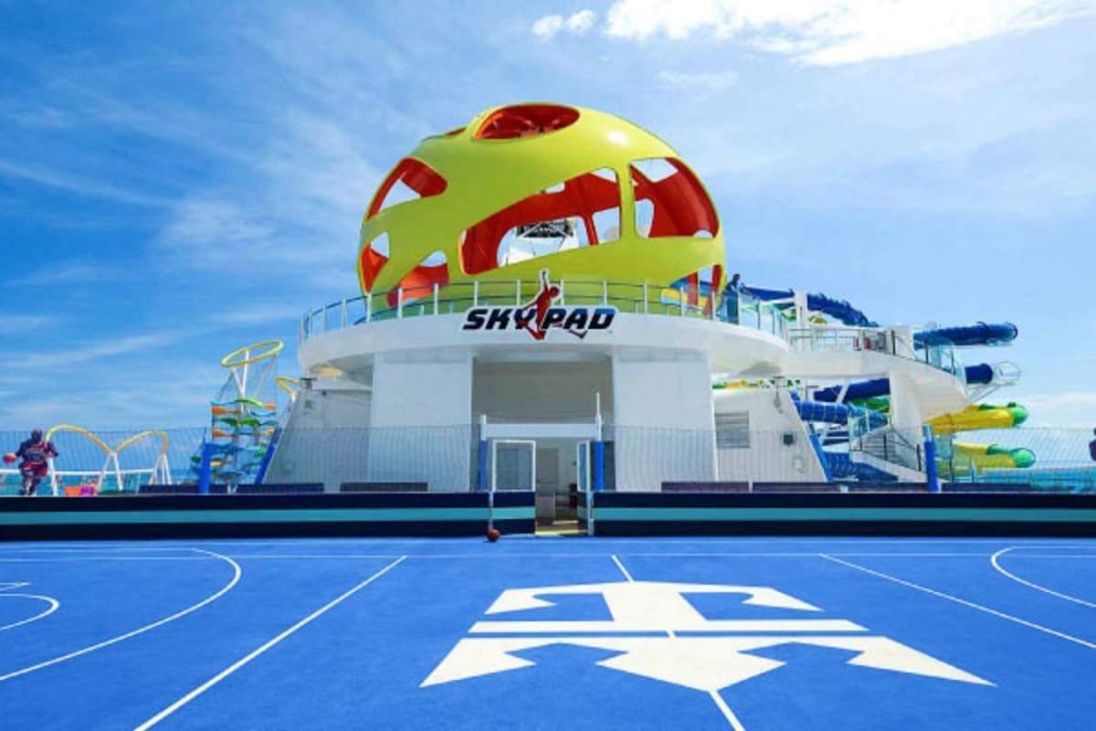 Skypad sports complex on Odyssey of the Seas cruise ship with basketball court and yellow-red recreational dome structure