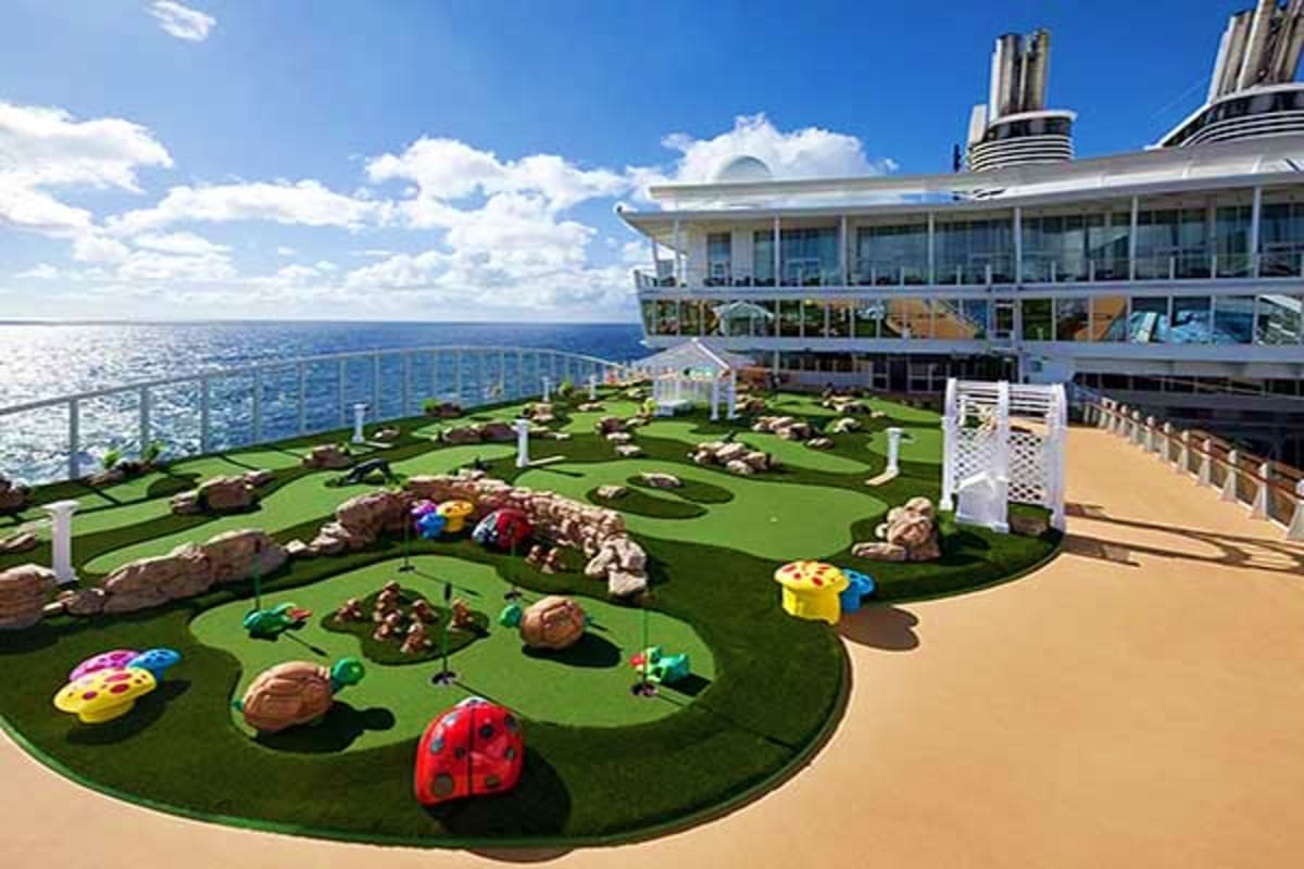 Mini golf course on Oasis of the Seas cruise ship deck with ocean view and colorful obstacles