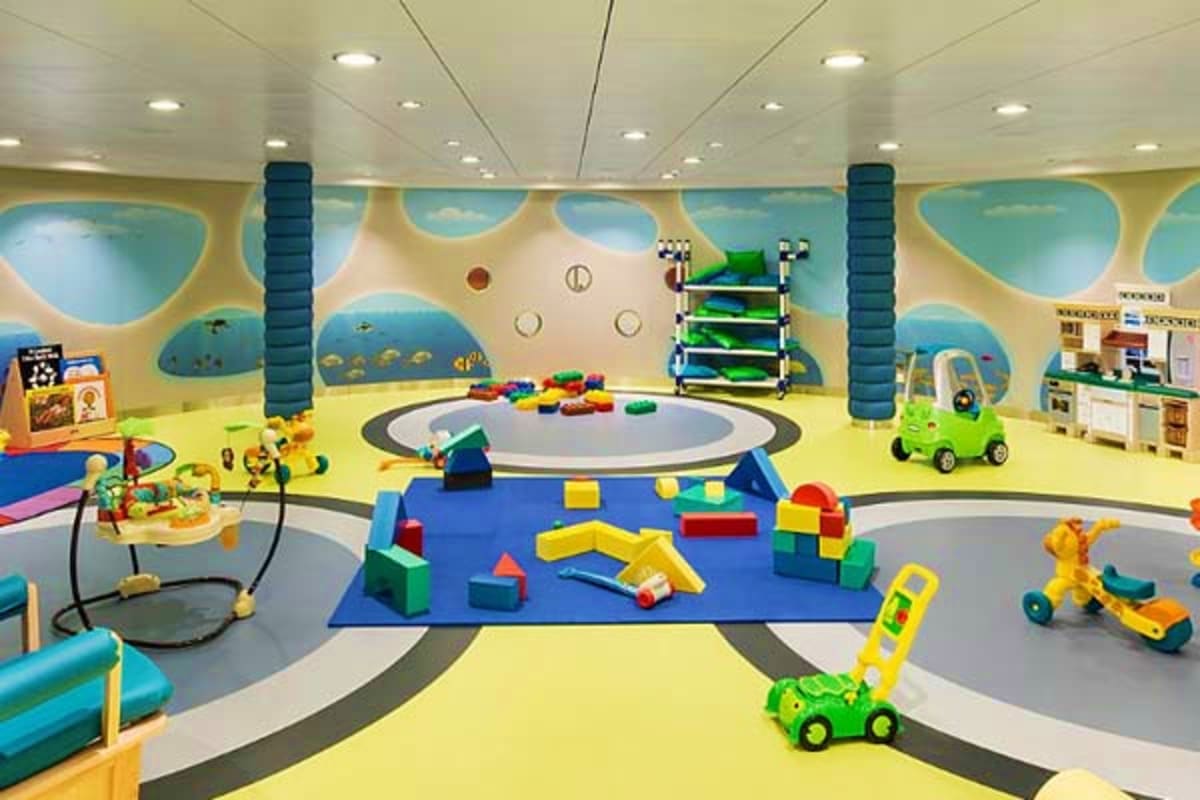 Modern daycare or play area with colorful toys, building blocks, and activity stations designed for young children