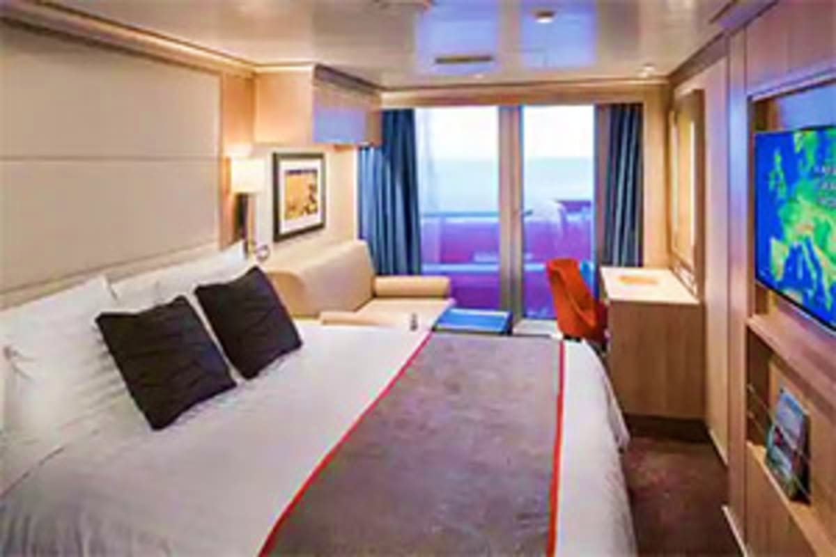 Nieuw Statendam Norway Voyage Luxury cruise ship stateroom with queen bed, ocean view balcony, flat-screen TV, and modern furnishings overlooking the sea