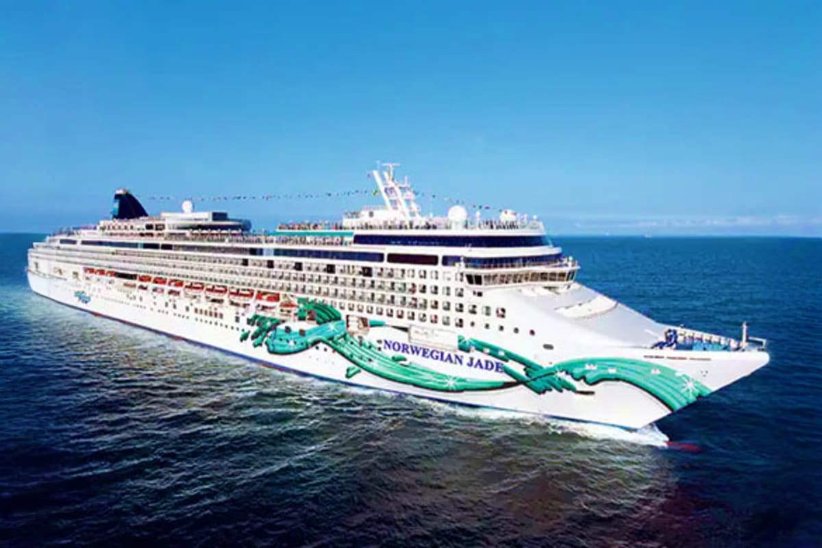 Norwegian Jade Japan Cruise Norwegian Jade cruise ship on blue ocean water with clear sky and turquoise hull design