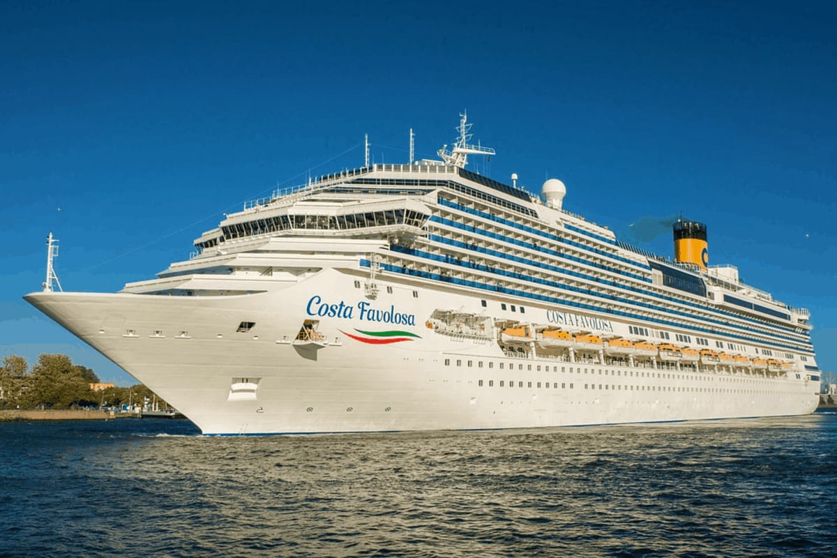 Costa Favolosa cruise ship anchored in blue water under clear sky