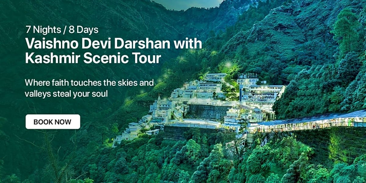 Vaishno Devi temple shrine nestled on a mountainside surrounded by dense green forests and steep valley cliffs in Kashmir