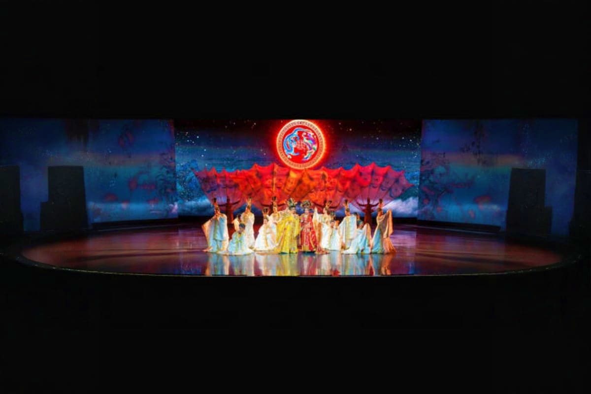 Colosseum Show Pattaya Colosseum Show Pattaya stage performance with colorful red and orange backdrop, performers in traditional costumes under spot