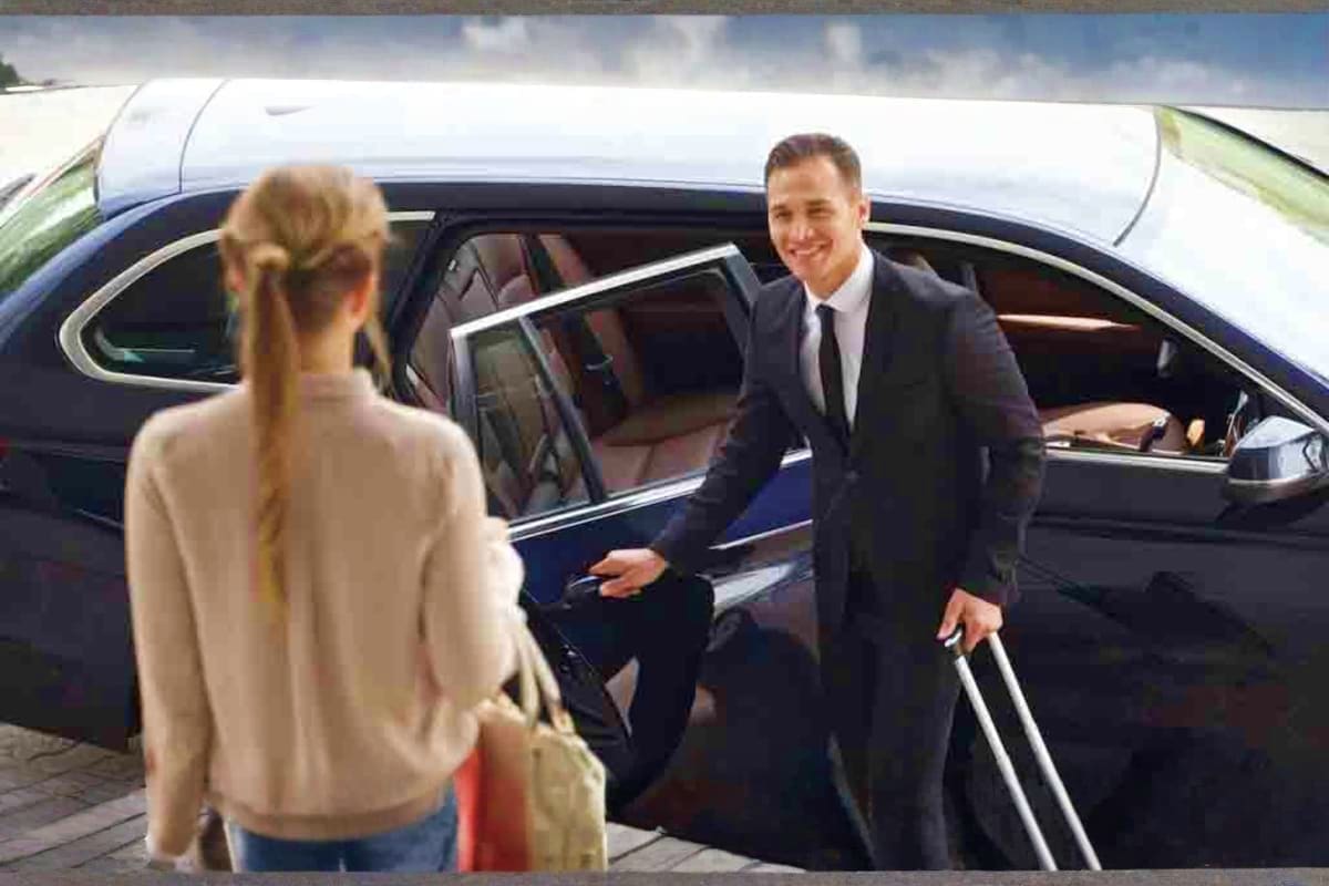 AAU Delegates Umrah Sharing Transfer Businessman in dark suit greeting woman with blonde hair at luxury car door, professional transportation service