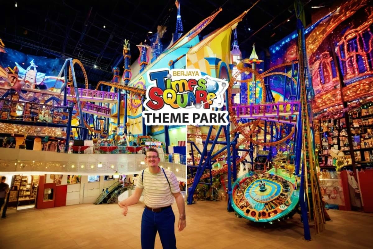 Berjaya Times Square Theme Park Kuala Lumpur Visitor posing inside Berjaya Times Square Theme Park with colorful indoor rides and attractions visible in background