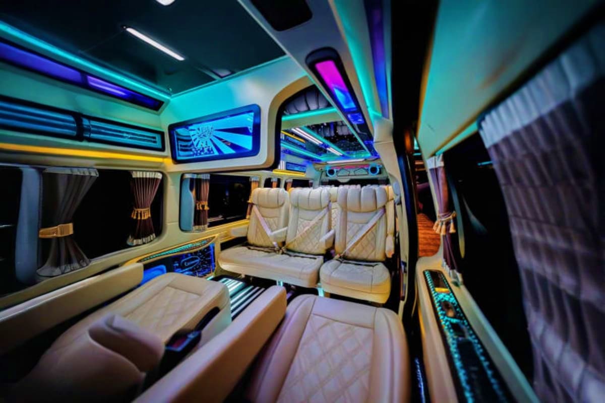 Luxury limousine interior with cream leather seats, neon blue and purple LED lighting, and modern amenities for airport trans