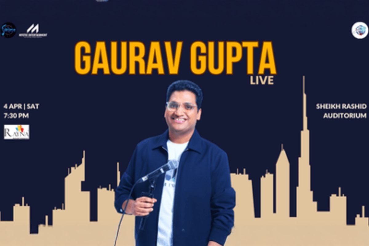 Gaurav Gupta Live in Dubai Gaurav Gupta holding microphone at live comedy show poster for April 4 at Sheikh Rashid Auditorium with Dubai skyline silhoue
