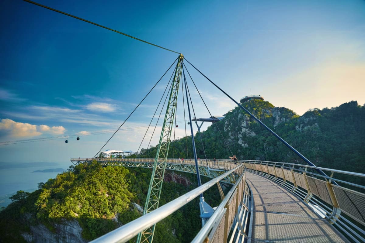 Langkawi Cable Car Langkawi Cable Car suspended bridge walkway with steel cables and railings overlooking forested mountains and sea below