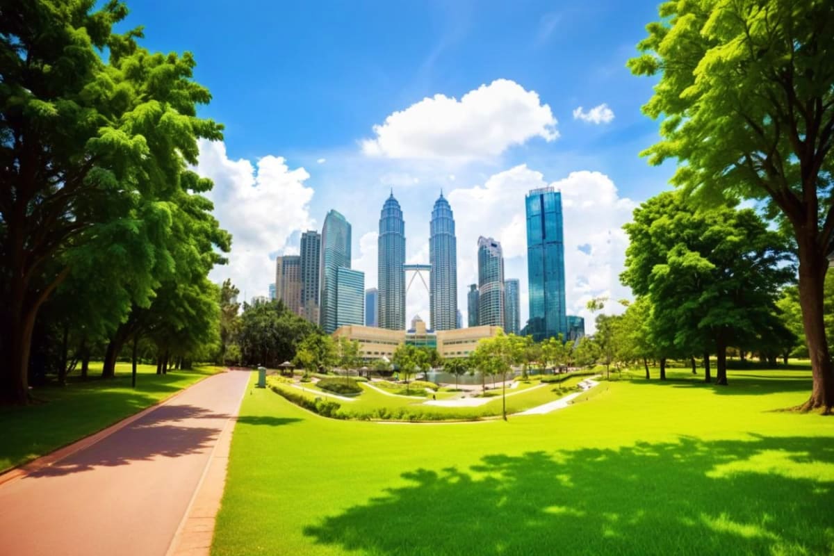 Petronas Twin Towers Kuala Lumpur Petronas Twin Towers viewed from KLCC Park with lush green lawns, tree-lined pathways, and walking trail in Kuala Lumpur