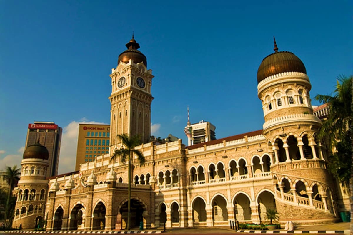 The Great Kuala Lumpur Iconic Attractions Tour Selangor State Secretariat building in Kuala Lumpur with clock tower and dome under blue sky