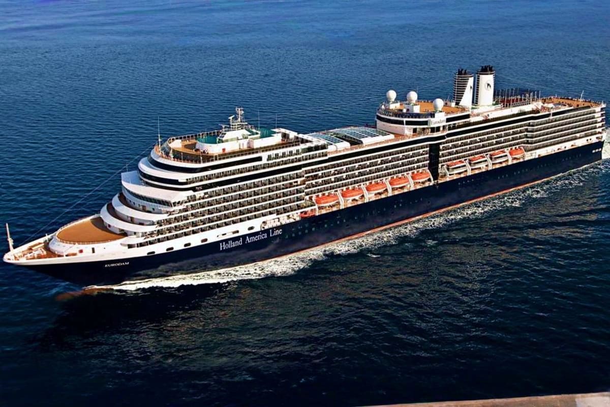 Eurodam Alaskan Explorer Voyage Holland America Line's Eurodam cruise ship anchored in clear blue water with multiple passenger decks and lifeboat rows visib