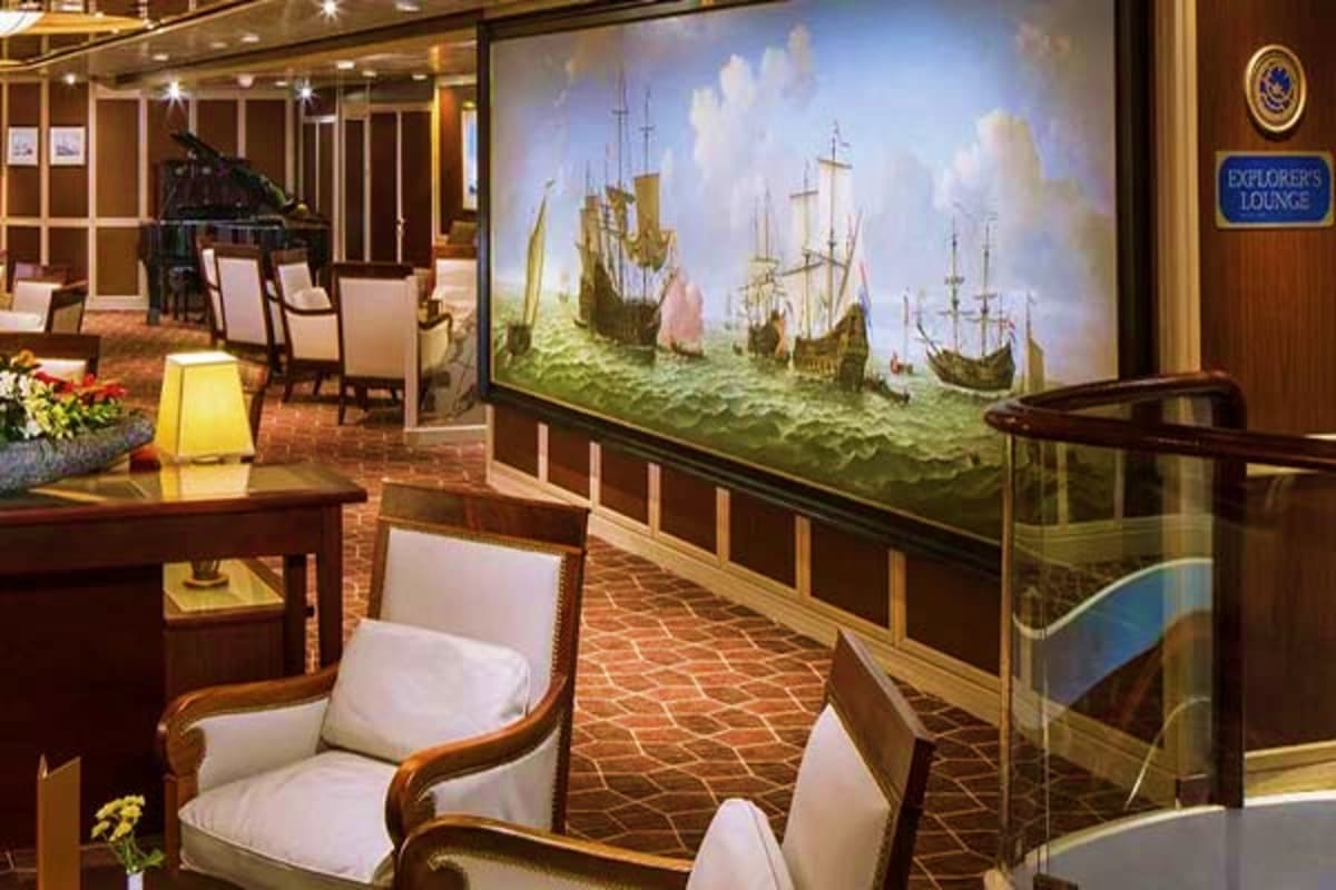 Eurodam Alaskan Explorer Voyage Explorers Lounge interior on Eurodam cruise ship featuring large mural of historic sailing ships, wooden furnishings, and ele