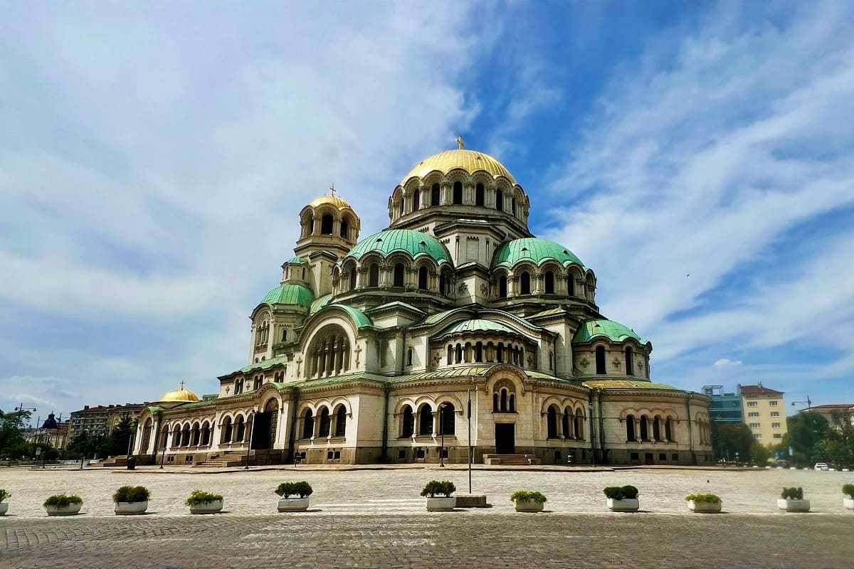 Sofia to Varna Cultural Trail Alexander Nevsky Cathedral in Sofia, Bulgaria, with golden domes and green copper roofs against blue sky