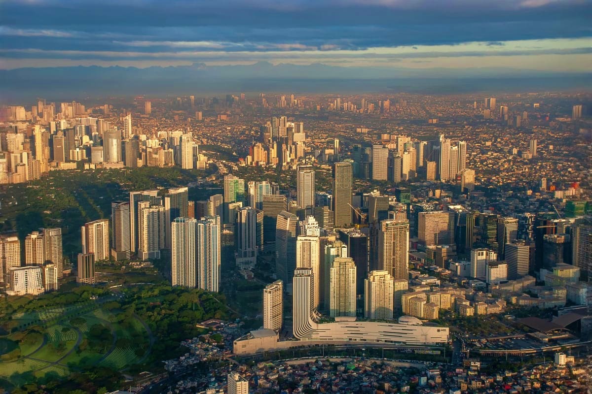 Aerial view of Chicago skyline at sunset with Lake Michigan shoreline and downtown high-rise buildings