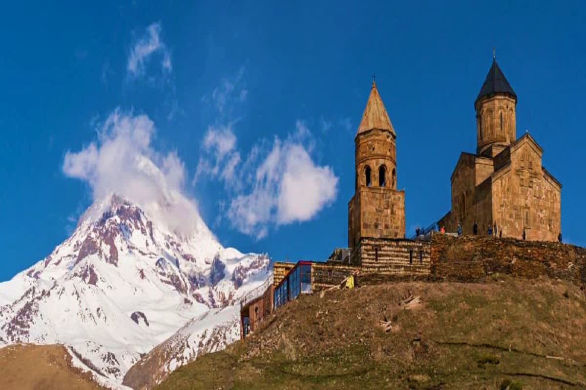 Khor Virap monastery with snow-capped Mount Ararat in the background under blue sky, Armenia
