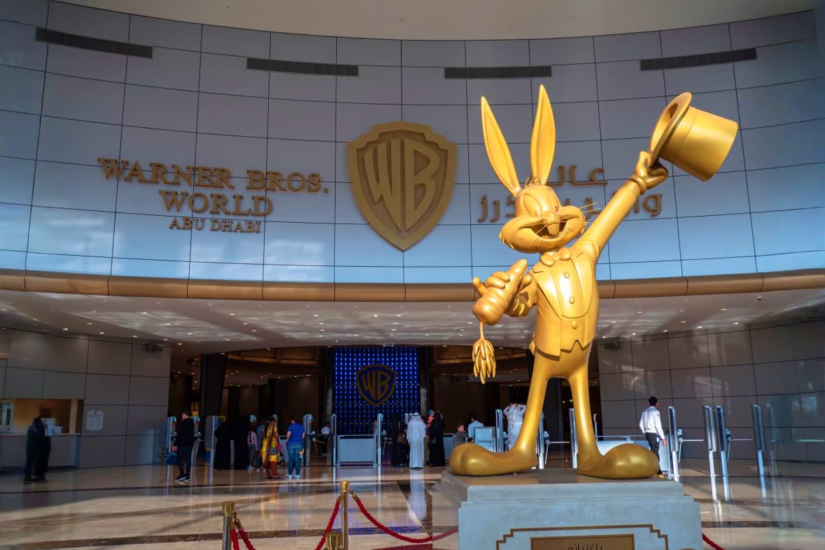Abu Dhabi Stay And Play Luxury Package Warner Bros. World Abu Dhabi entrance with golden Bugs Bunny statue holding a mallet in the lobby