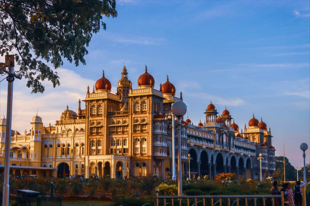 Ornate palace with golden domes and red spires in Mysore, Karnataka, a historic landmark showcasing Indian royal architecture
