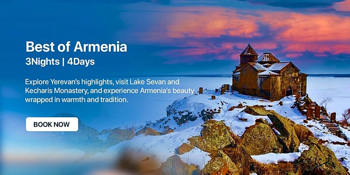Sevan Monastery situated on a snowy peninsula surrounded by Lake Sevan in Armenia during winter with blue sky and sunset clou