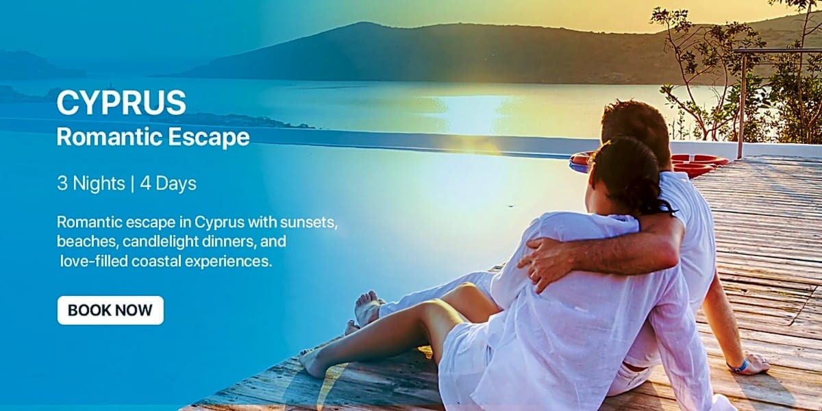Couple sitting on wooden deck overlooking calm blue Mediterranean sea and mountains at sunset in Cyprus
