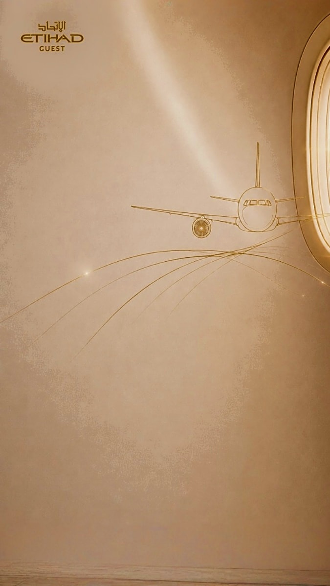 Etihad Guest airline logo with gold-outlined aircraft and circular design elements on beige textured background