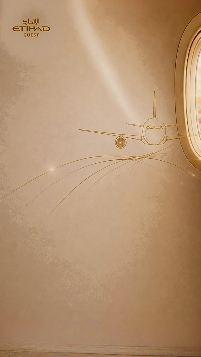 Etihad Guest logo with gold-outlined airplane and circular window design on beige textured background