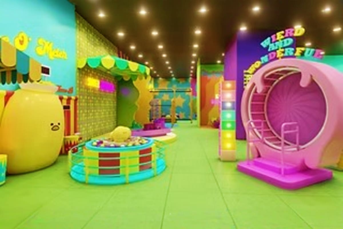 Gootopia in SM North Quezon City Colorful indoor play area at Gootopia with yellow character structures, ball pit, pink tunnel slide, and neon signage