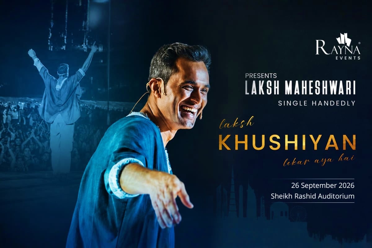 Laksh Maheshwari performing on stage at Sheikh Rashid Auditorium, smiling and gesturing to audience during Khushiyan live sto