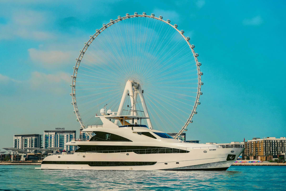 Stardom Luxury yacht Stardom positioned in front of the London Eye observation wheel on the Thames River