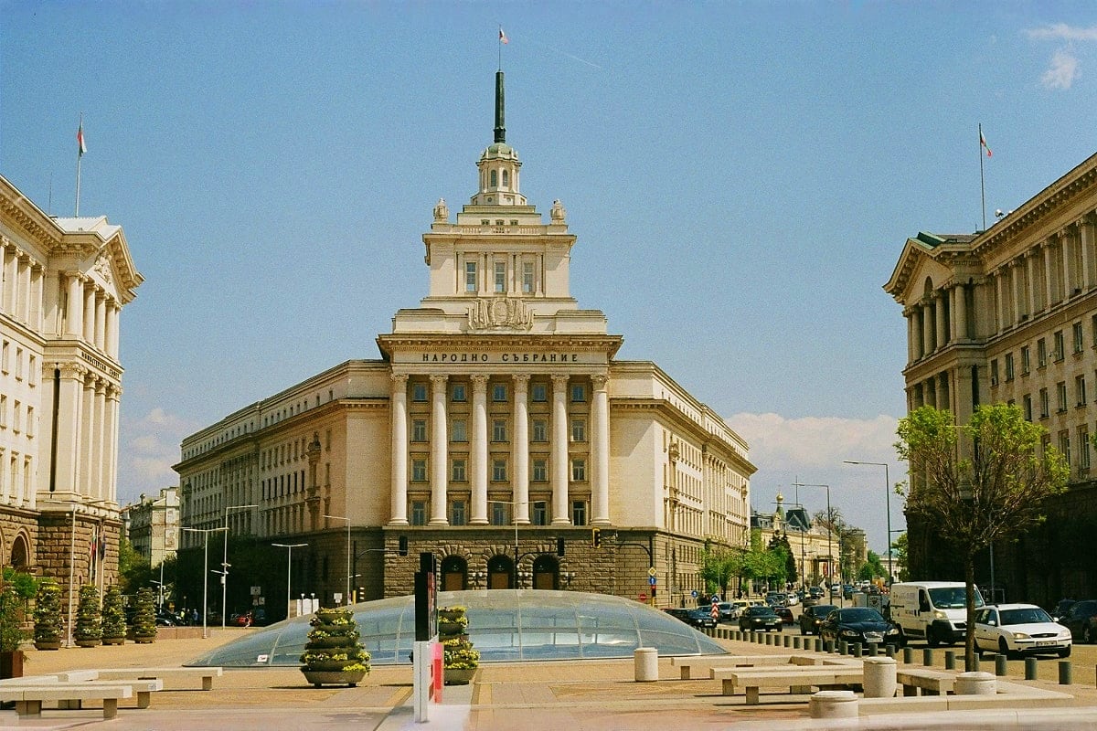 National Assembly building in Sofia, Bulgaria with classical columns and central dome, surrounded by government architecture 
