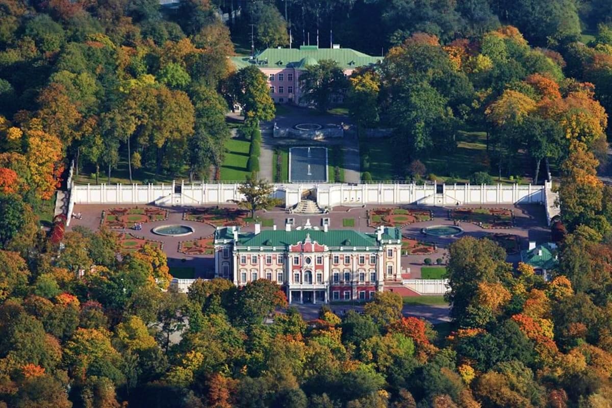 Aerial view of pink Kadriorg Palace surrounded by autumn forest in Tallinn, Estonia
