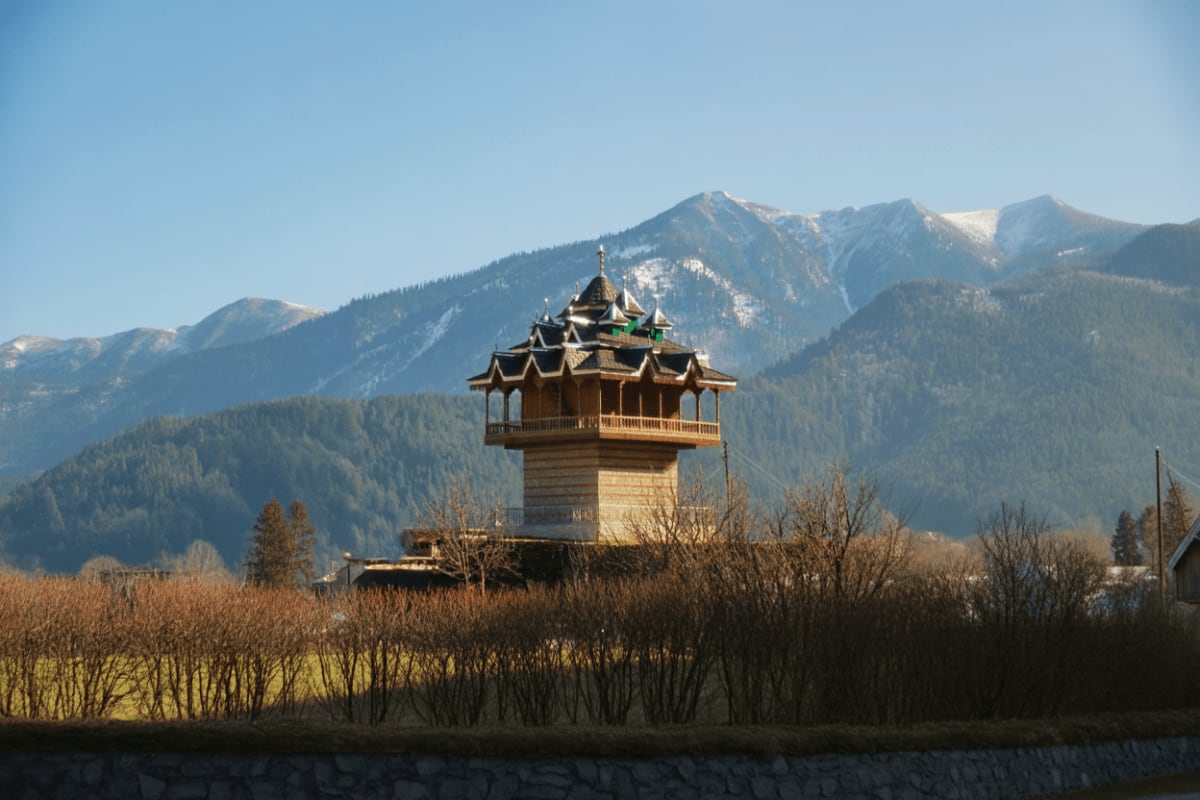 Himachal Family Explorer with Nature Temples and Snow Valleys Buddhist temple tower with tiered golden roof and mountains in background, Himachal Pradesh valley landscape with evergreen f