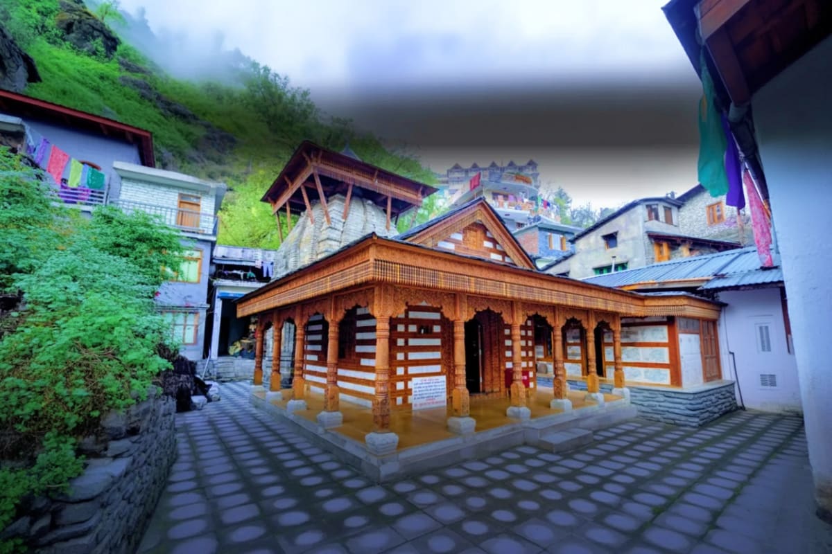 Himachal Family Explorer with Nature Temples and Snow Valleys Traditional wooden temple with ornate carved pillars and striped architecture nestled in misty Himalayan valley surrounded by