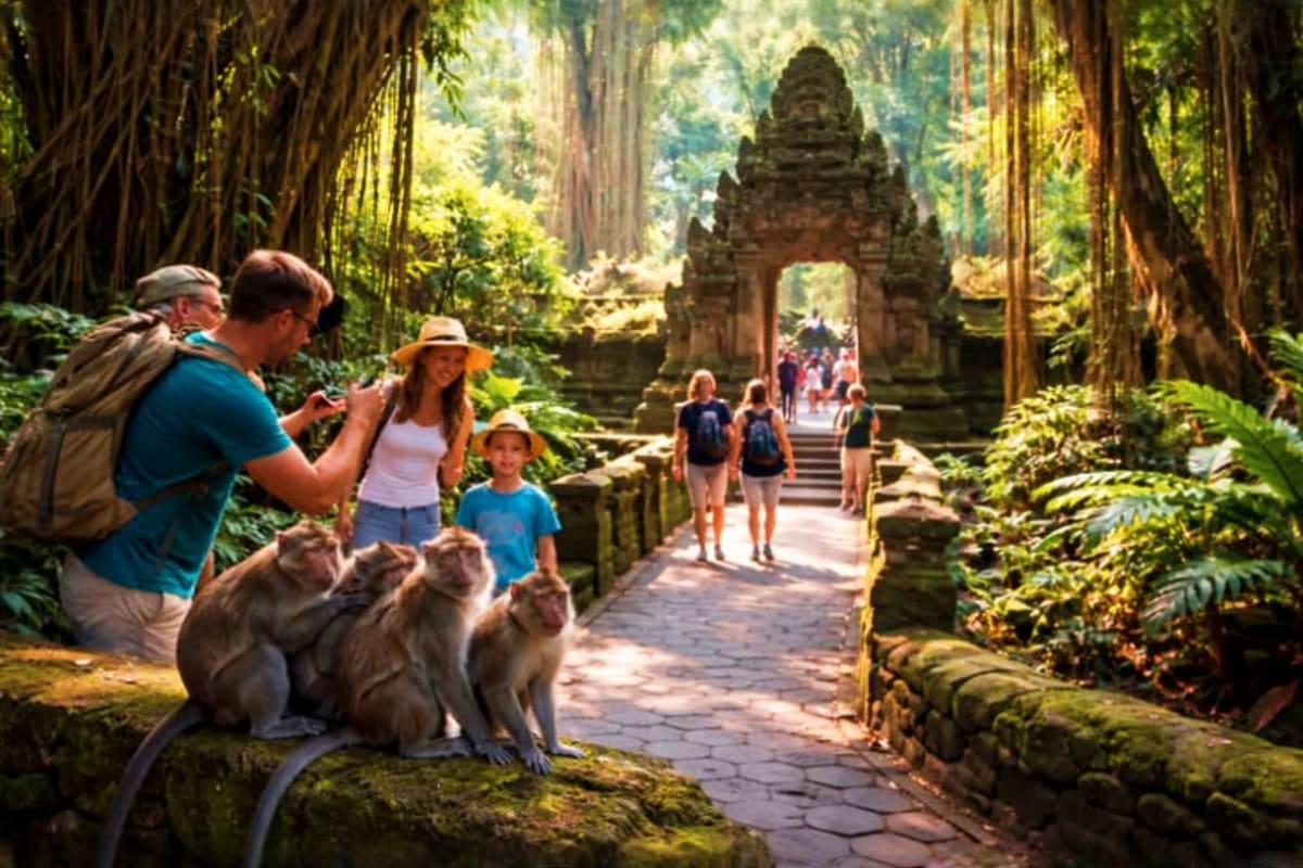 Family with monkeys on stone pathway through ancient temple gate surrounded by tall trees in Bali forest sanctuary